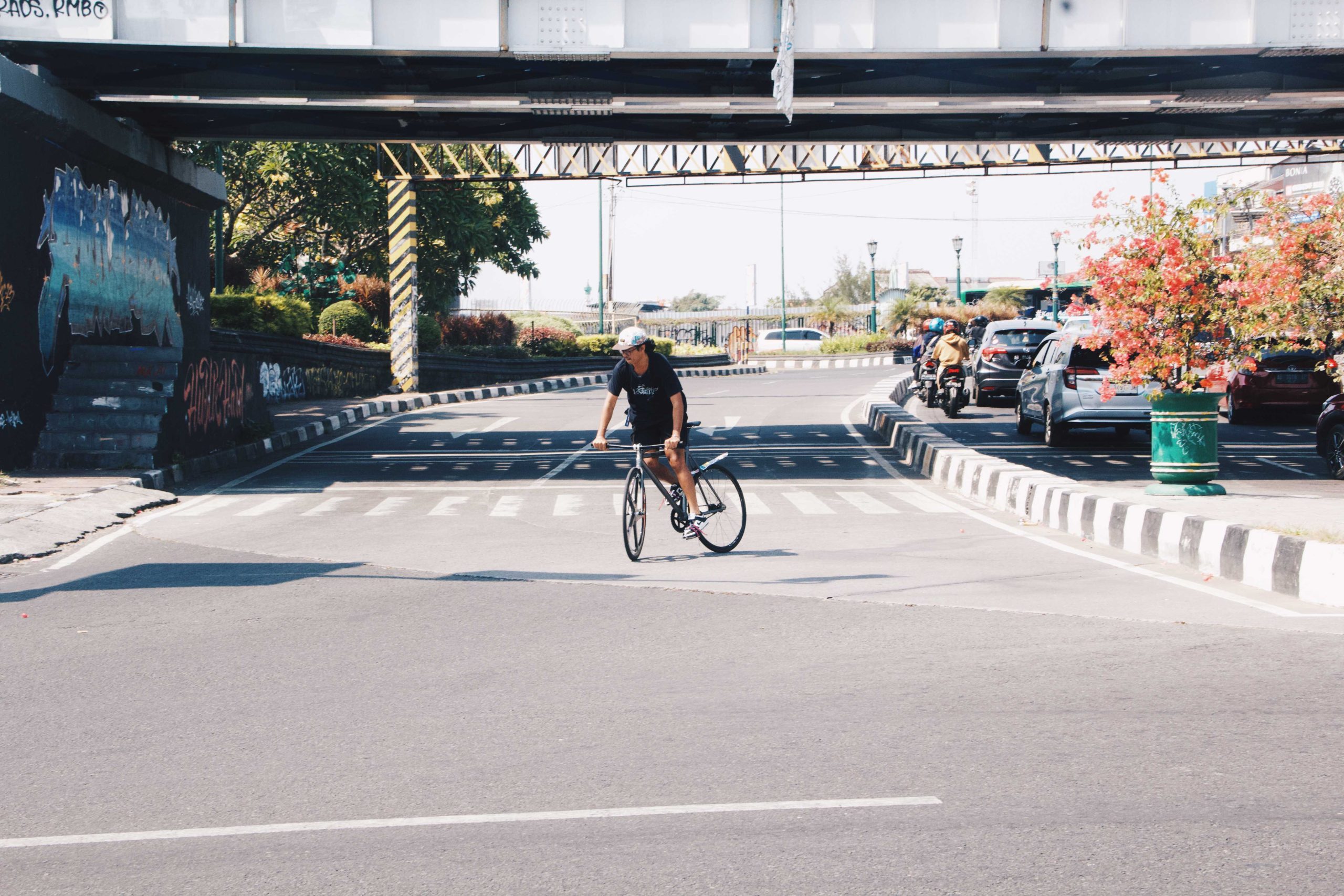 fixed gear bike skid under the train bridge in yogyakarta cities